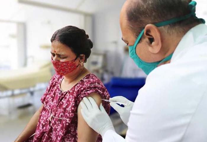 Woman receiving vaccine