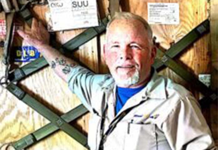 Joe Murphy on the main deck on the aircraft carrying military cargo.