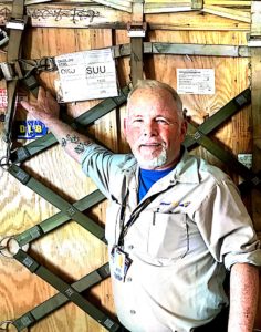 Joe Murphy on the main deck on the aircraft carrying military cargo.