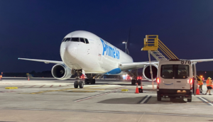 Front view of a Prime Air plane in the evening.