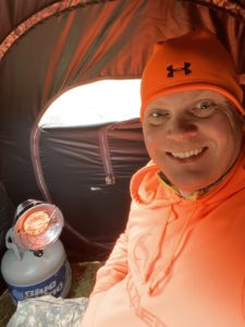 Tom freezing in a tent during deer hunting season.