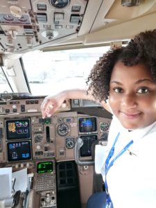 First Officer Phyllis Manoah in the cockpit.